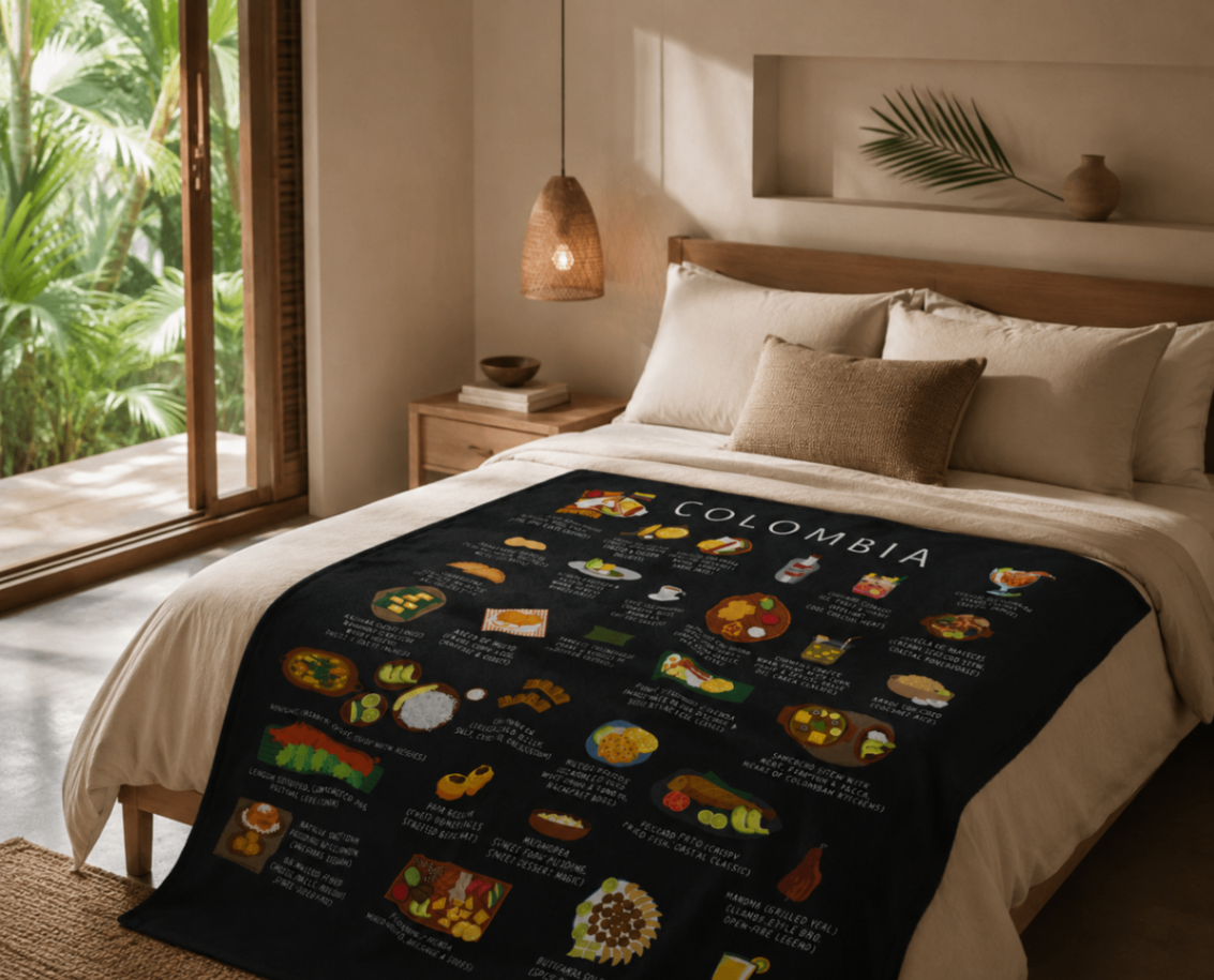 Black Colombia food blanket draped over a linen bed in a warm bedroom with palms beyond the window
