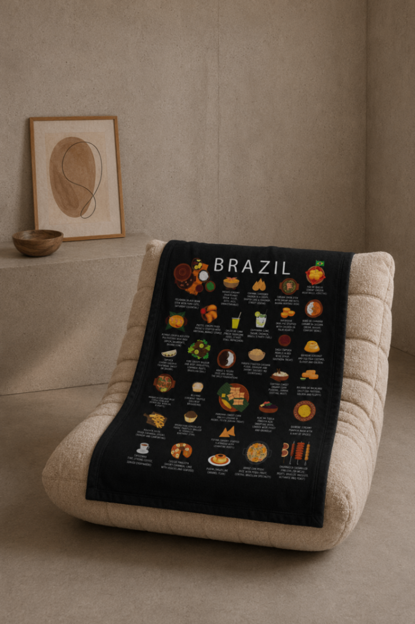 Black Brazil food blanket draped over a cream bouclé lounge chair in a warm plaster-walled room