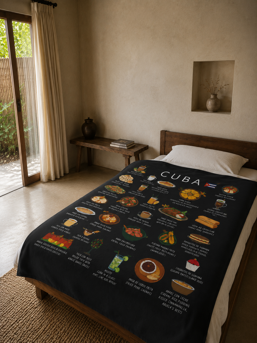 Black Cuba food blanket draped over a linen bed in a warm plaster-walled bedroom with open garden doors