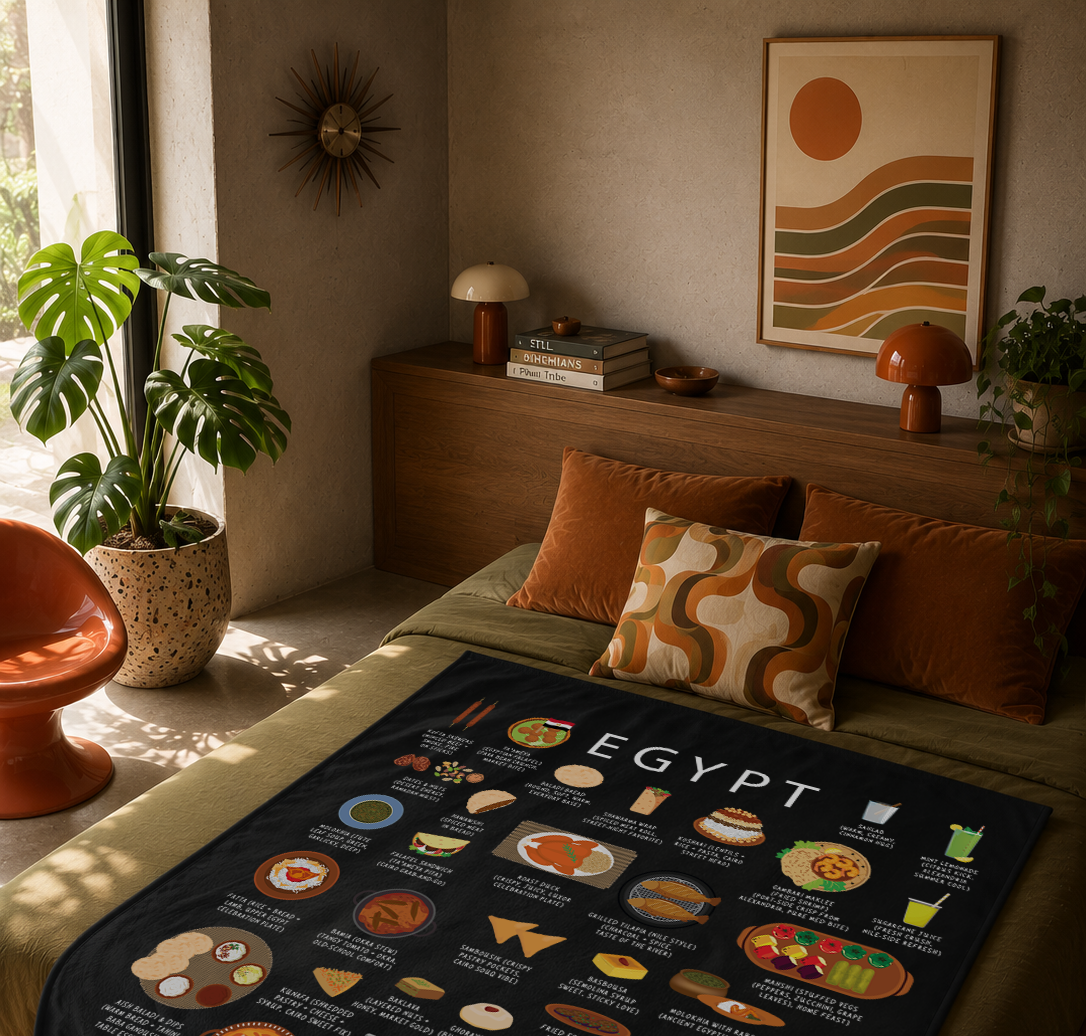 Black Egypt food blanket styled on an olive daybed with terracotta cushions and warm mid-century lighting