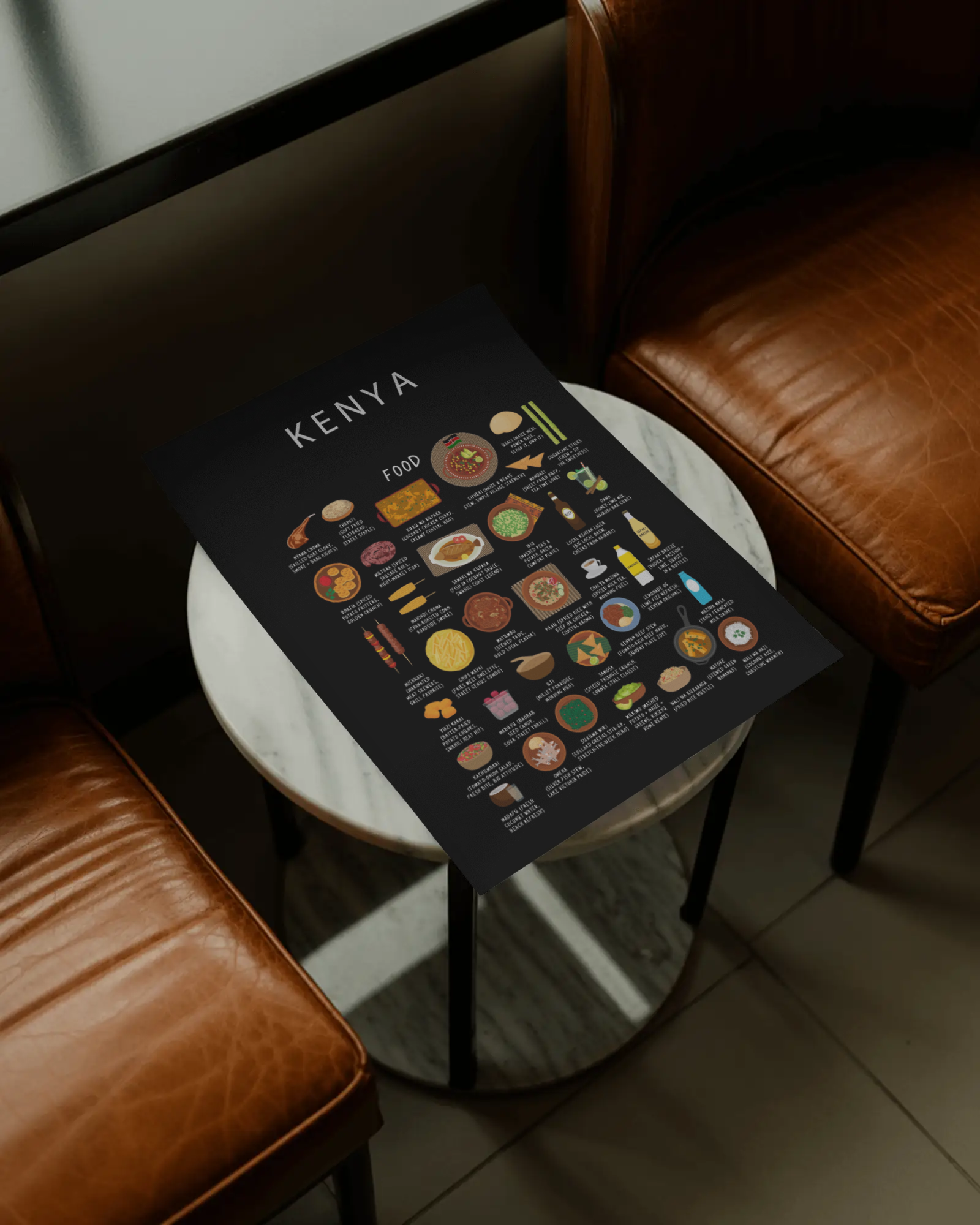 Black Kenya food poster resting on a marble café side table between leather armchairs