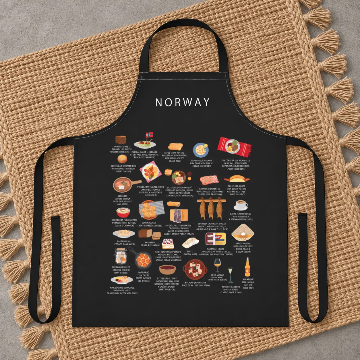 Black Norway food apron displayed on a woven natural rug