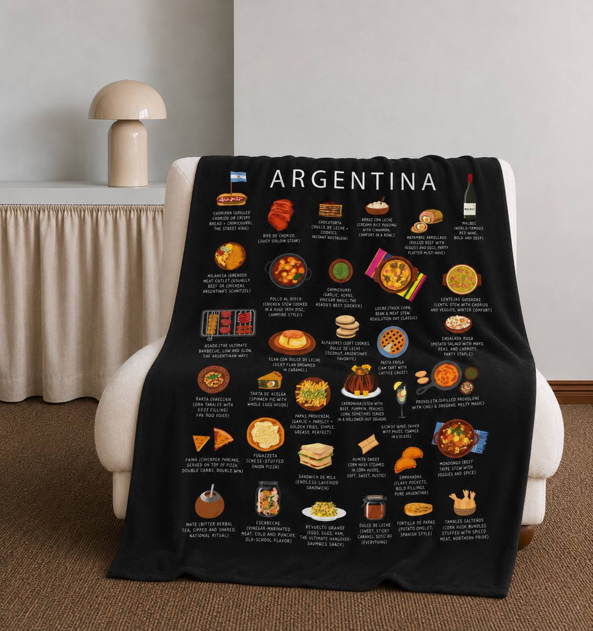 Black Argentina food blanket draped over a cream armchair beside a sculptural table lamp