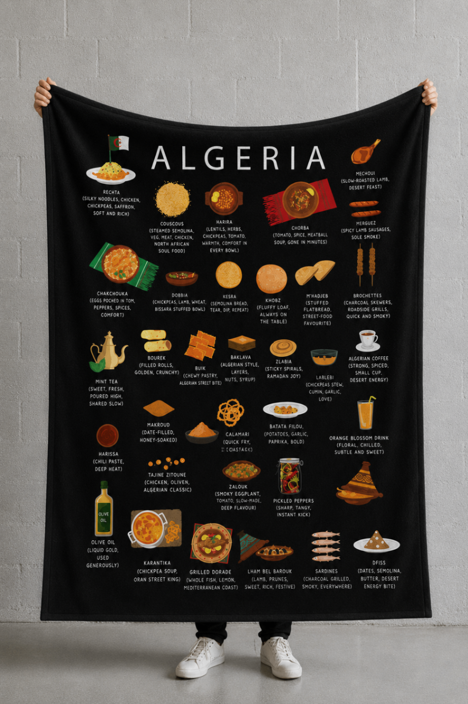 Black Algeria food blanket held open against a soft concrete wall