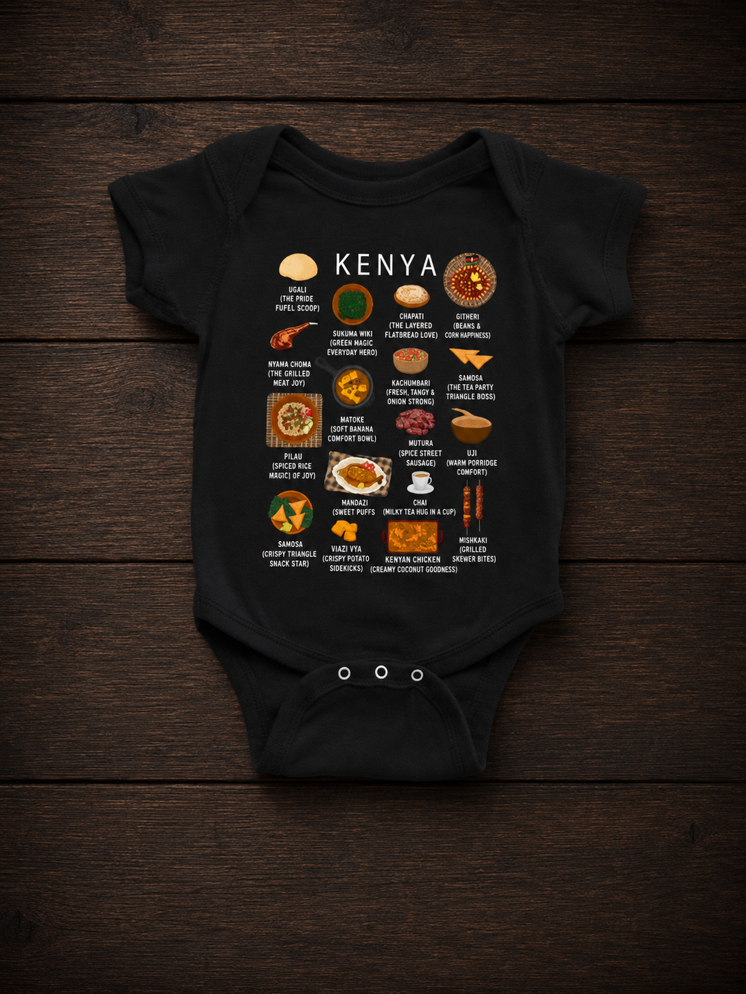 Black Kenya food baby onesie styled on a dark wooden surface