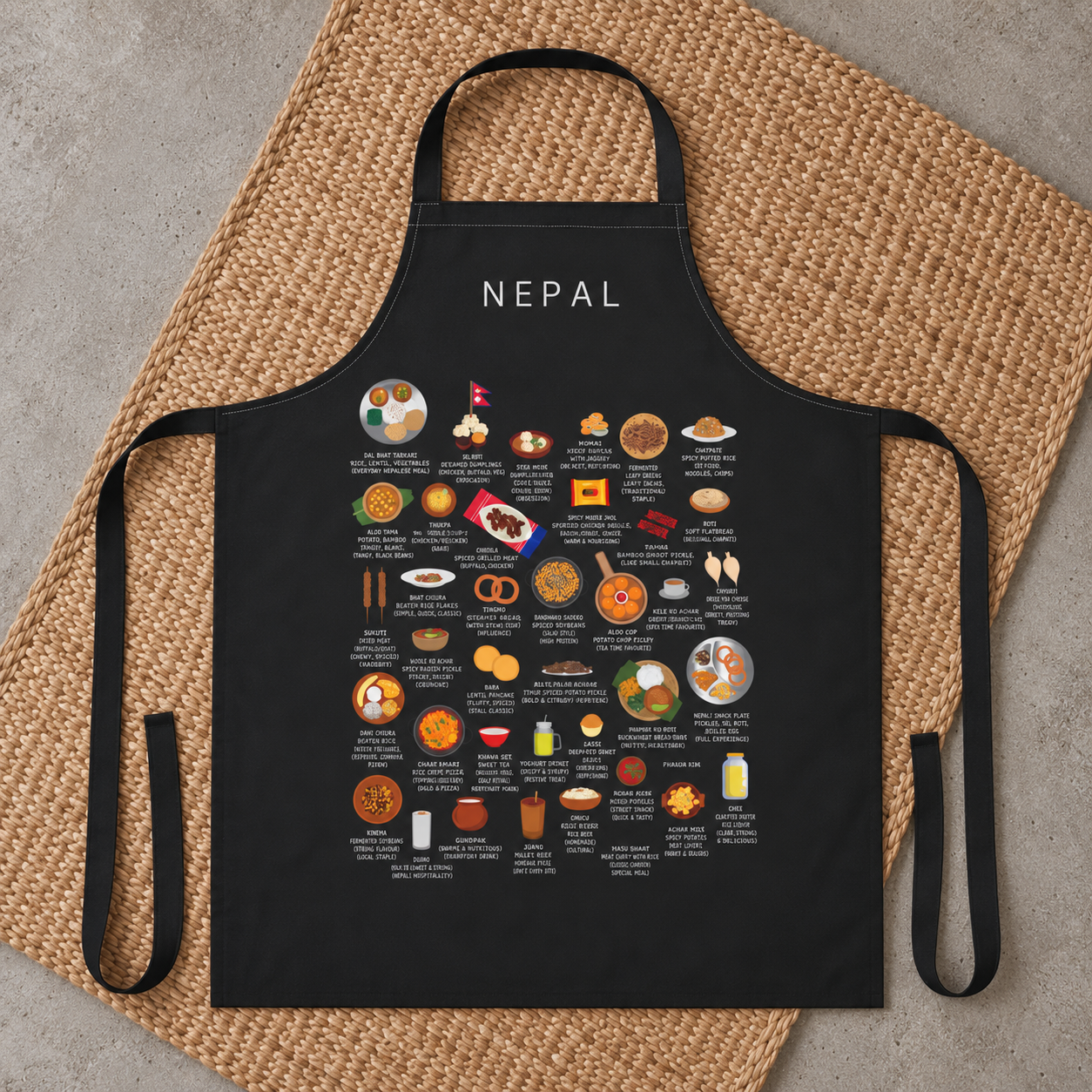 Black Nepal food apron arranged on a handwoven natural mat