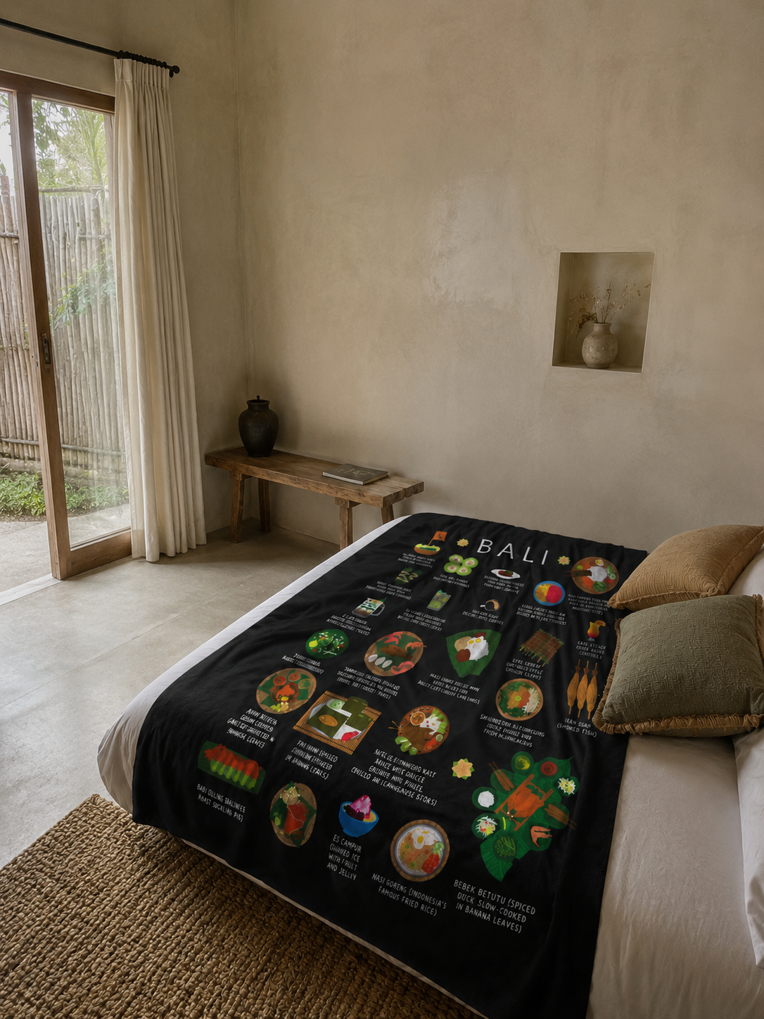 Black Bali food blanket draped across a bed in a warm, minimal plaster-walled bedroom